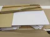 a pile of papers sitting on top of a cardboard box