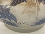 a close up of a blue and white bowl on a table