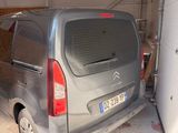 a van parked in a garage next to a wall