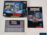 two boxes of nintendo games sitting on a table