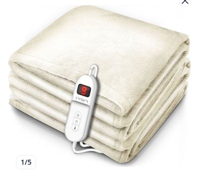 an image of a blanket with a remote control on it