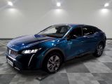 the blue suv is parked on a checkered floor in a garage