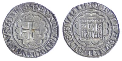 a close up of two silver coins with a cross on them