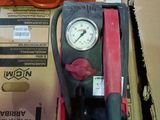 a box with a gauge and a box of other items