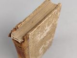 an old book that is sitting on a table