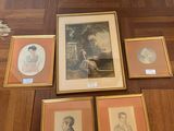 four framed pictures on the floor of a room