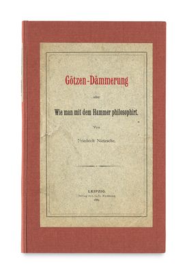 un vieux livre avec une couverture rouge sur fond blanc