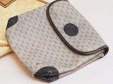 a bag that is sitting on a table next to a pair of gloves