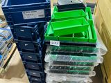 many plastic bins stacked on top of each other