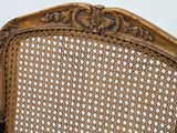 a close up of a wicker chair with a white background
