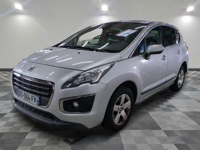 the small white car is parked in a large room