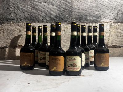 several bottles of wine are lined up on a table