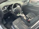 the interior of a car with a steering wheel and a dash board