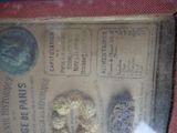 an old newspaper with a bunch of coins on it