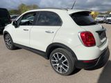 a white fiat suv parked in a parking lot