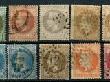 a group of stamps with different faces on them