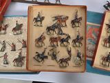 a lot of figurines in a box on a table