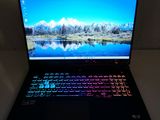 a laptop that is sitting on a table in the dark