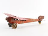 toy airplane with wheels on a white surface with a white background