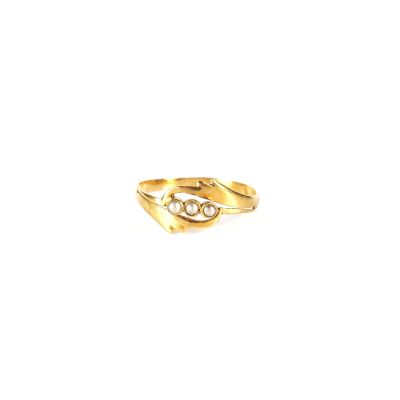 a close up of a gold ring on a white background