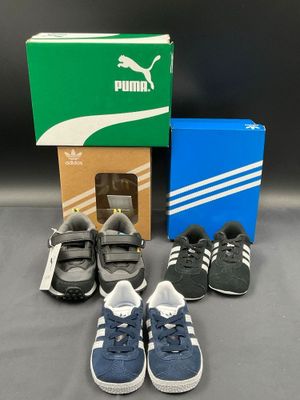 a box of children ' s shoes and a box of shoes