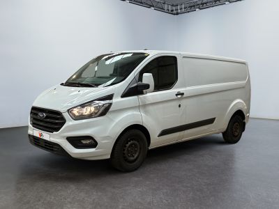 the white van is parked in a large room