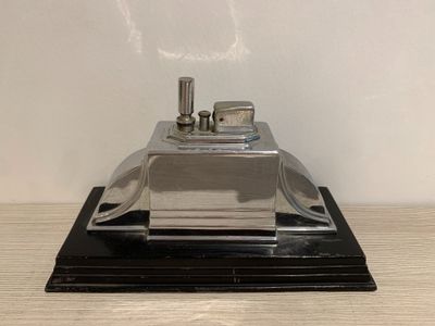 a small metal object on a wooden table