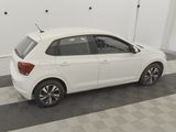 the white car is parked in the garage on the checkered floor