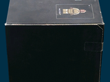 a black box with a label on it on a blue background
