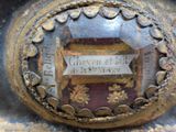 a close up of a metal object with a plaque on it