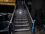 a metal stair going up to the top of the stairs