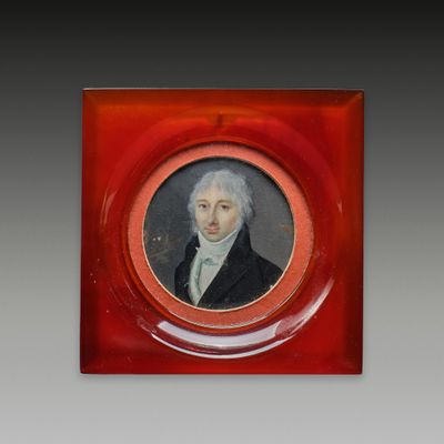 portrait of a man in a red frame with a white beard