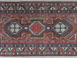 an old persian rug with geometric design and fringe fringes