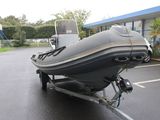 a boat on a trailer parked in a parking lot