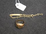 a close up of a ring and a chain on a table