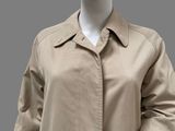 an image of a mannequin mannequin wearing a beige jacket