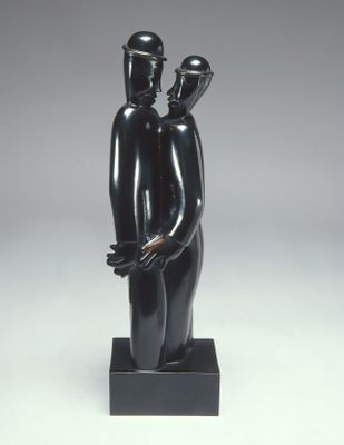 statue of a man and woman holding a baby