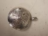 a silver locke with a star design on it