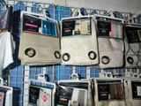 many bags hanging on a rack in a store