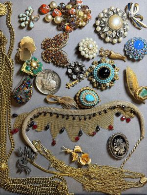 many different types of jewelry displayed on the table