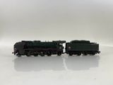 two toy trains that are sitting on a white surface