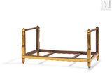 a small wooden bed with a wooden frame on it