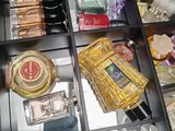 many different types of perfumes in this drawer