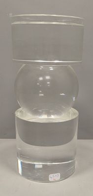 a clear container with water in it sitting on a table