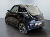 an image of a smart car parked in a showroom