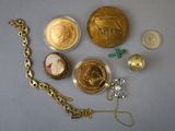 a lot of gold and silver items that are on the table