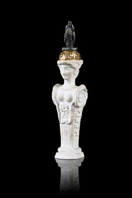 a statue of a woman with a hat on top of her head