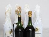 three bottles of wine sitting next to each other on a table