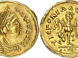 a gold coin with an image of a man on it