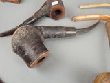 many different types of pipe smokings on a table
